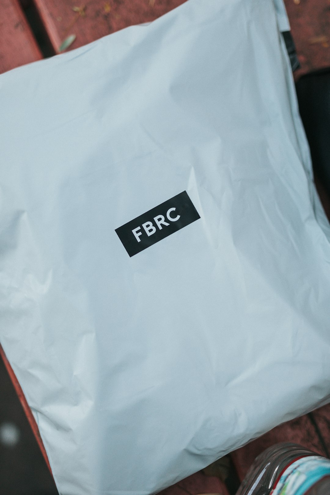 FAQ by Purse Brands white and red plastic pack